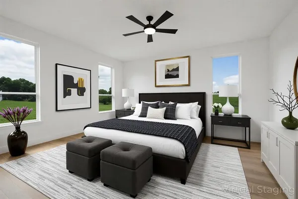 a spacious bedroom with a bed and a couch