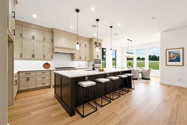 a living room with furniture kitchen view and a table