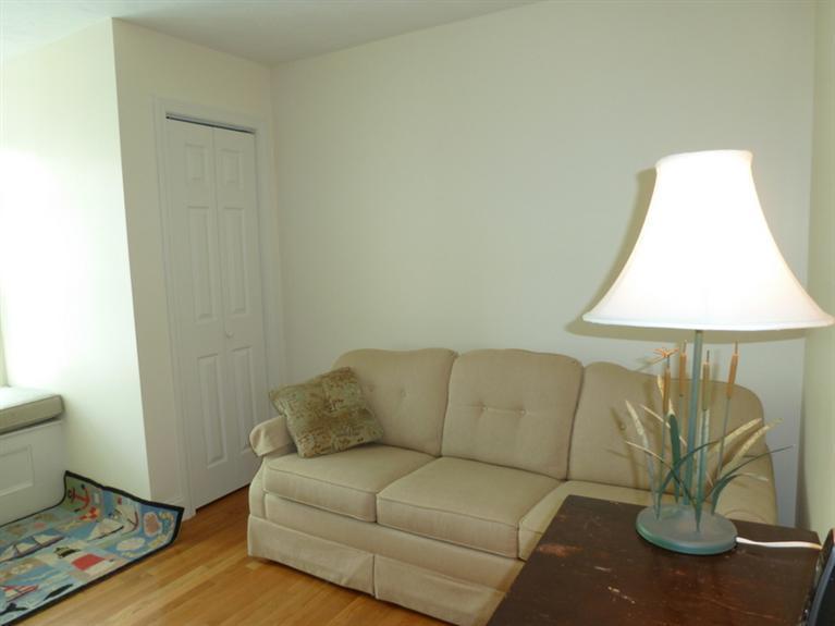 6 Penelope Road Bourne, MA 02532 - Photo 11 of 13 a living room with furniture and a lamp