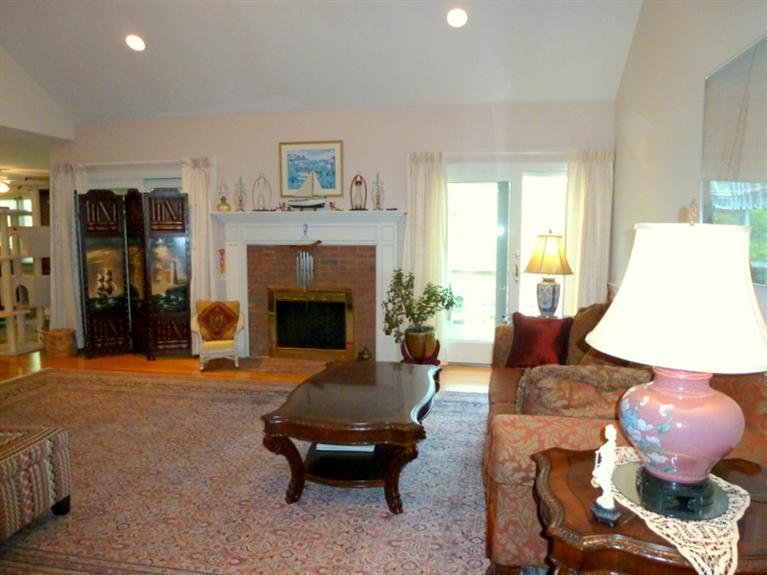 6 Penelope Road Bourne, MA 02532 - Photo 4 of 13 a living room with furniture and a fireplace