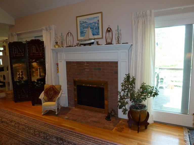 6 Penelope Road Bourne, MA 02532 - Photo 5 of 13 a living room with furniture and a fireplace