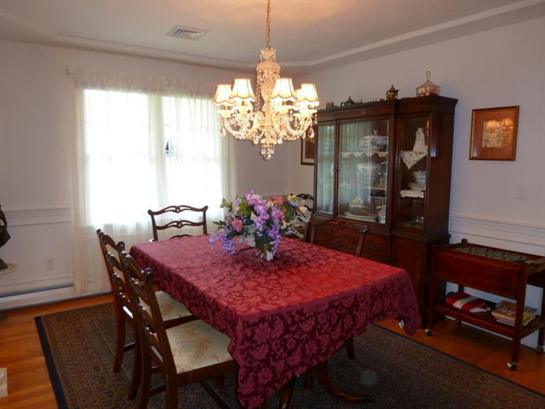 6 Penelope Road Bourne, MA 02532 - Photo 7 of 13 a view of a dining room with furniture and chandelier