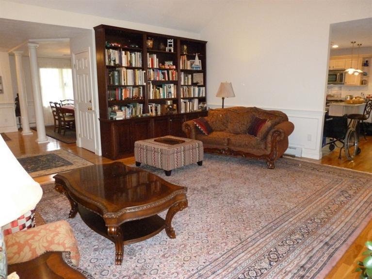6 Penelope Road Bourne, MA 02532 - Photo 8 of 13 a living room with furniture and a book shelf