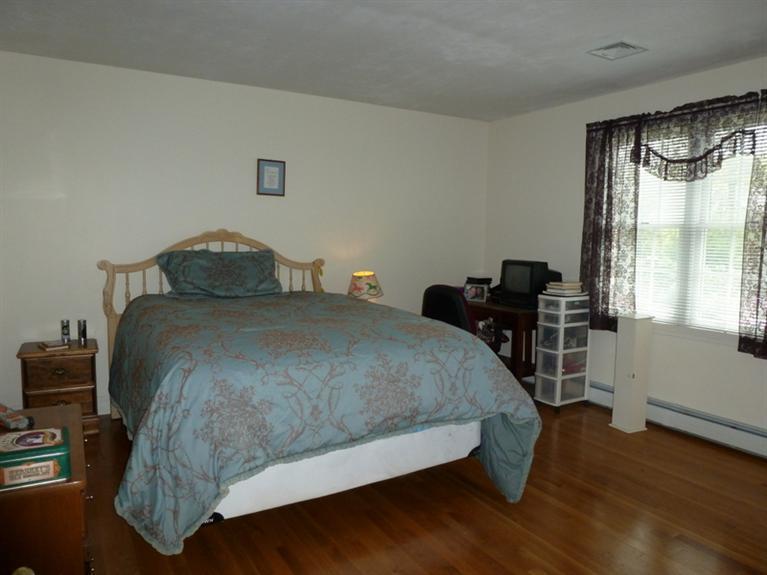 6 Penelope Road Bourne, MA 02532 - Photo 10 of 13 a bed sitting in a bedroom next to a window