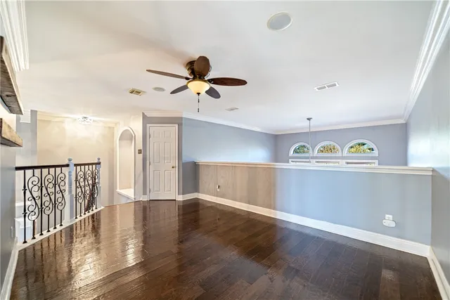 a view of room with window and ceiling fan