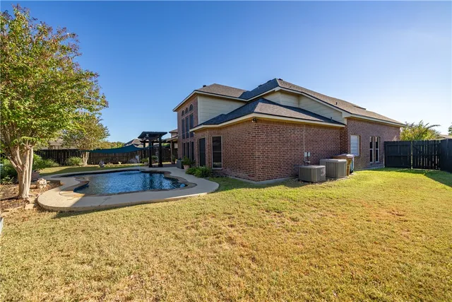 a view of a house with a swimming pool