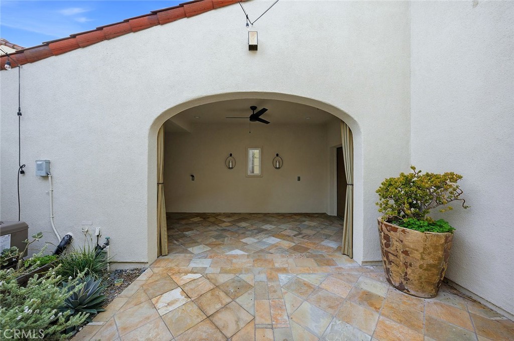 65 Greenhouse Irvine, CA 92603 - Photo 11 of 25 a view of a stone house with a potted plant