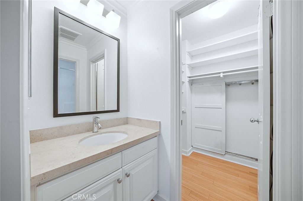 65 Greenhouse Irvine, CA 92603 - Photo 15 of 25 a bathroom with a sink and a mirror