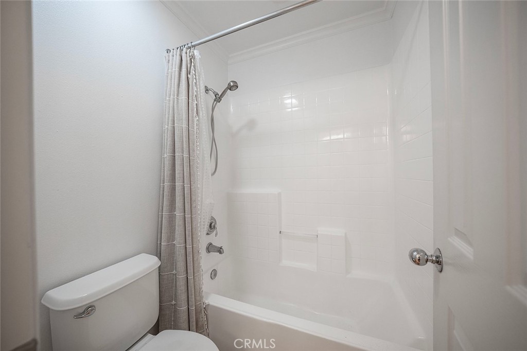 65 Greenhouse Irvine, CA 92603 - Photo 20 of 25 a bathroom with a shower and a toilet