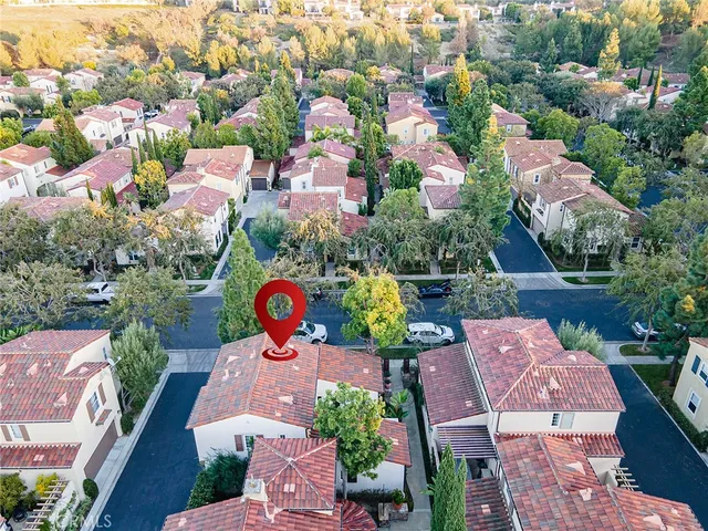 an aerial view of a house with yard swimming pool and outdoor seating