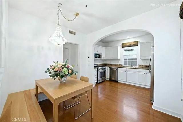 a kitchen with a white cabinets and white appliances