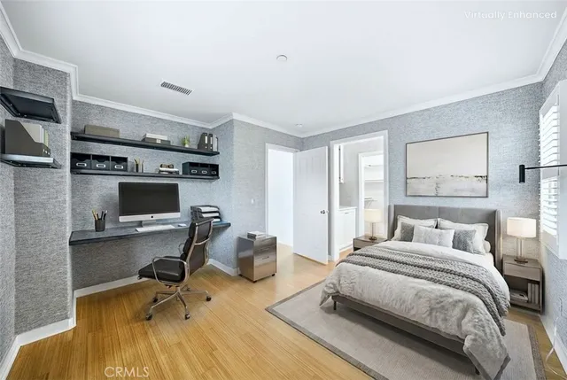 a bedroom with a bed a desk and chair