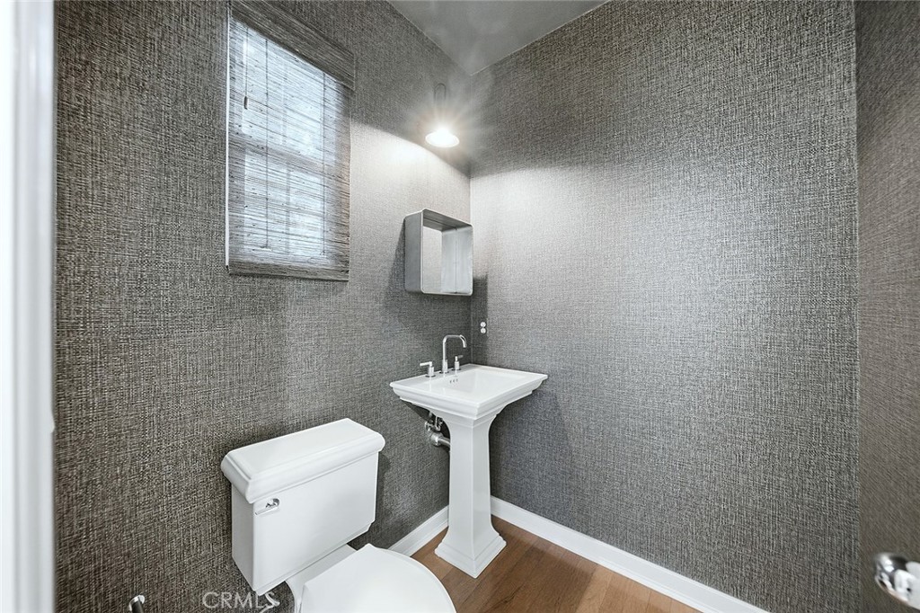 65 Greenhouse Irvine, CA 92603 - Photo 10 of 25 a bathroom with a sink toilet and a mirror