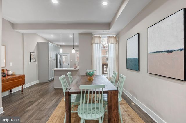 a kitchen with stainless steel appliances a refrigerator stove and sink
