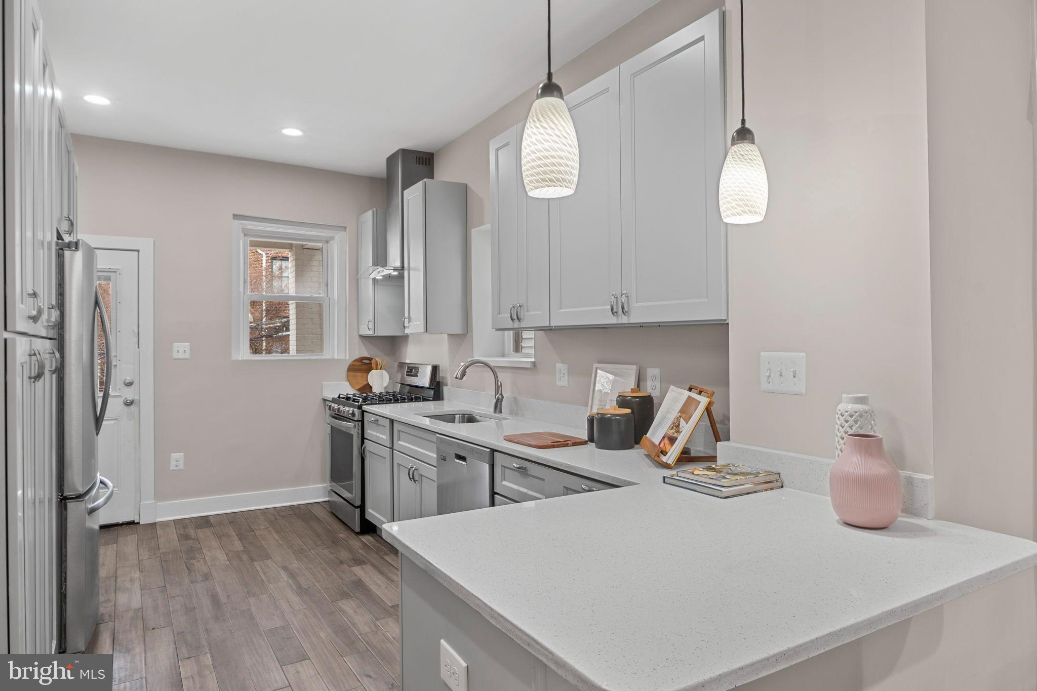113 R Street Northeast Washington, DC 20002 - Photo 13 of 46 Modern kitchen with sleek finishes.