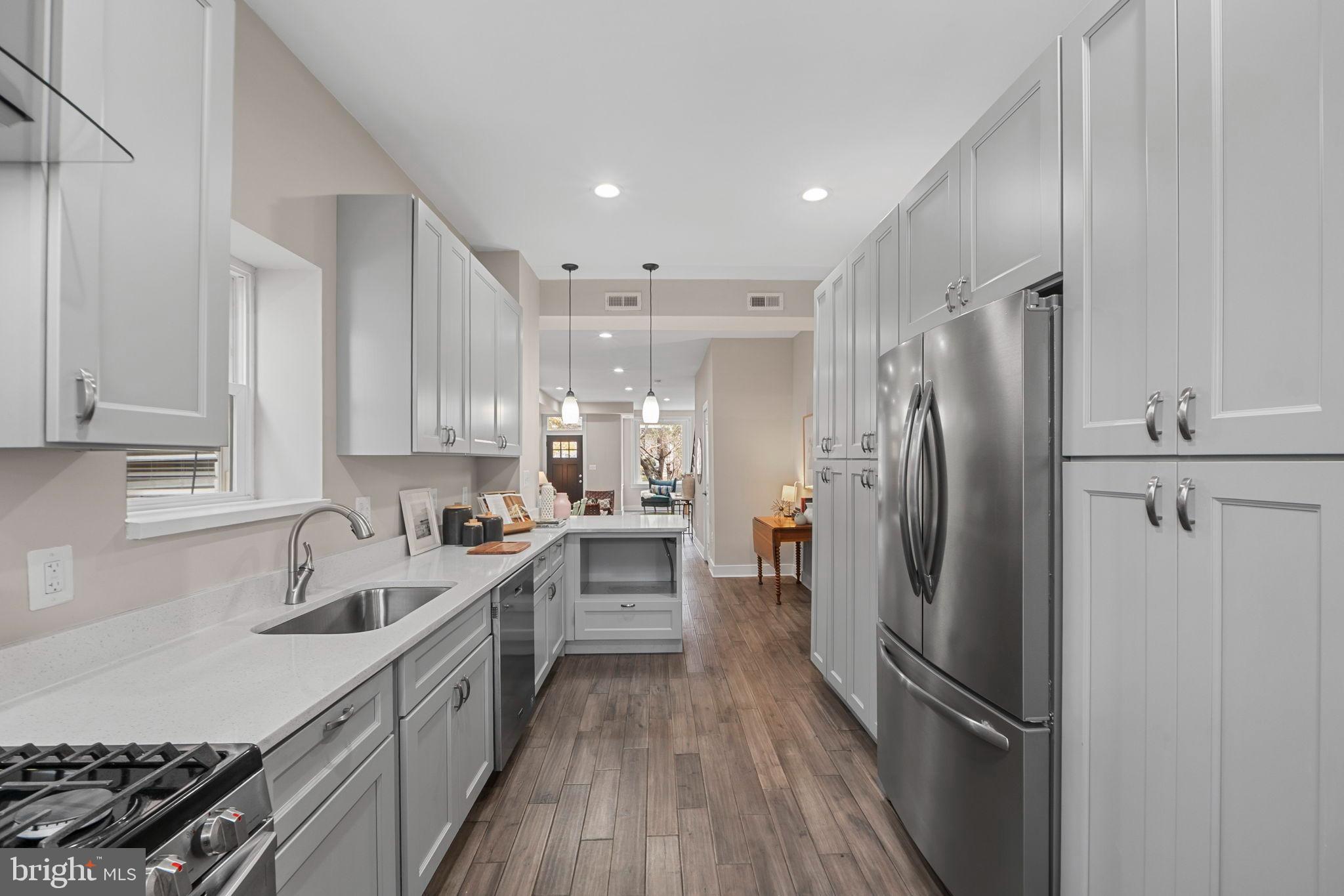 113 R Street Northeast Washington, DC 20002 - Photo 14 of 46 Sleek modern kitchen with elegant finishes.