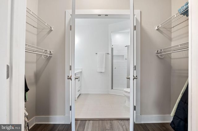 a bedroom with furniture and wooden floor
