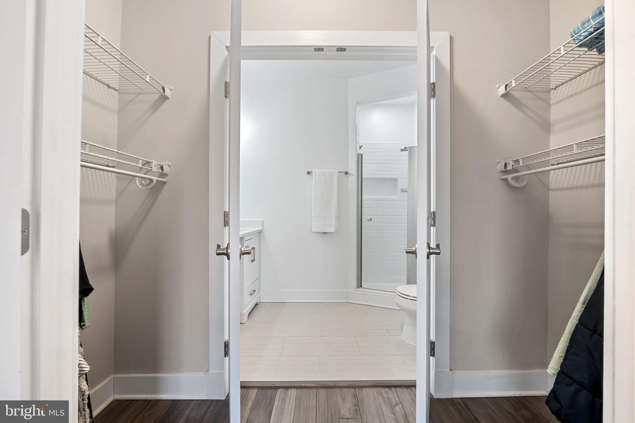 113 R Street Northeast Washington, DC 20002 - Photo 20 of 46 Spacious closet leading to a bright bathroom.