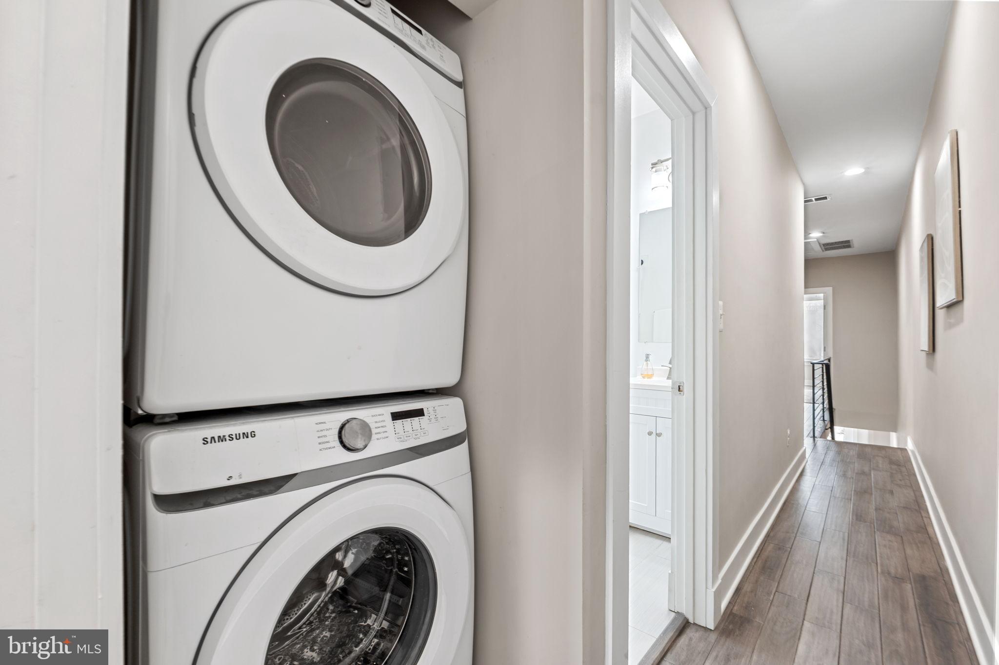 113 R Street Northeast Washington, DC 20002 - Photo 29 of 46 Modern laundry setup in a sleek hallway.