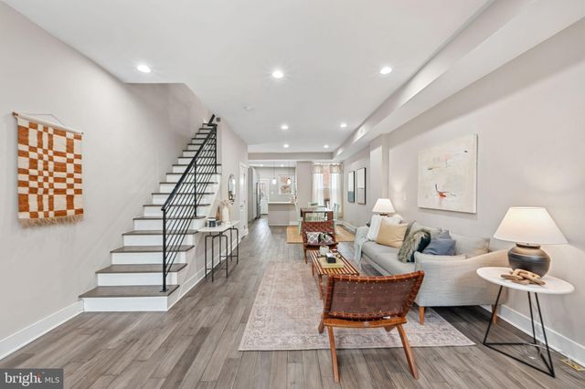 a living room with furniture and a rug