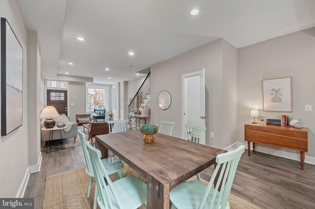 a kitchen that has a lot of cabinets in it and appliances