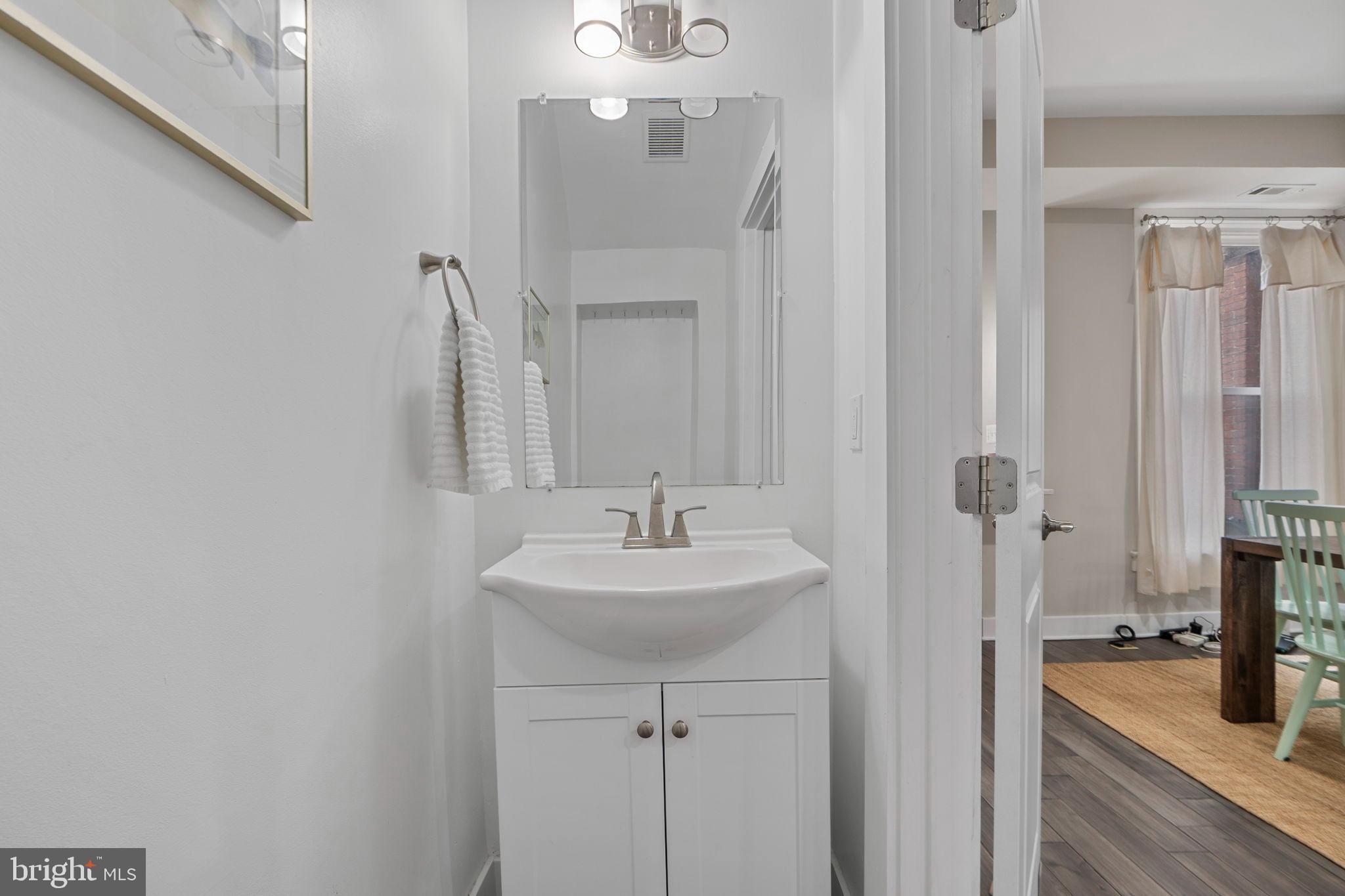 113 R Street Northeast Washington, DC 20002 - Photo 10 of 46 Sleek modern bathroom with elegant fixtures.