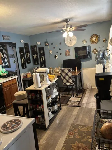 a view of a room with workspace and music instruments
