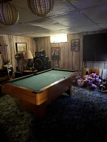 a living room with furniture a lamp and a fireplace