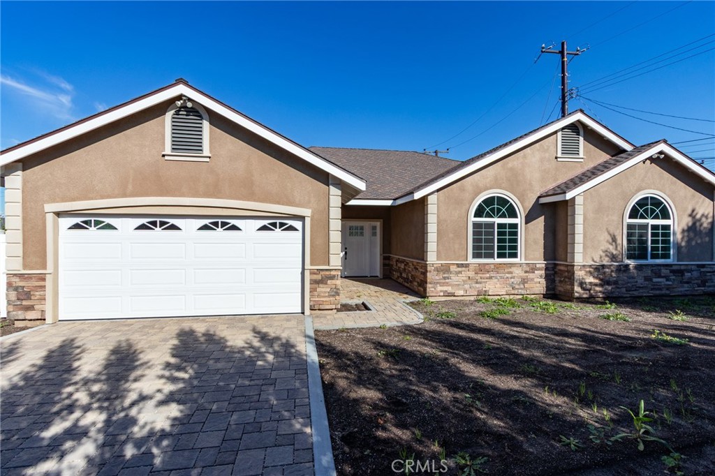 11128 Stamy Road Whittier, CA 90604 - Photo 2 of 40 a front view of a house with a yard