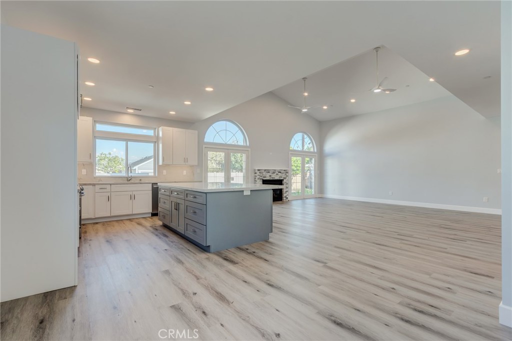 11128 Stamy Road Whittier, CA 90604 - Photo 21 of 40 a view of kitchen and empty room with wooden floor