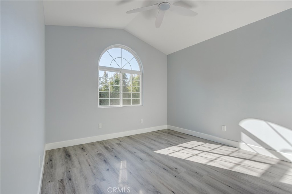 11128 Stamy Road Whittier, CA 90604 - Photo 30 of 40 an empty room with wooden floor and windows