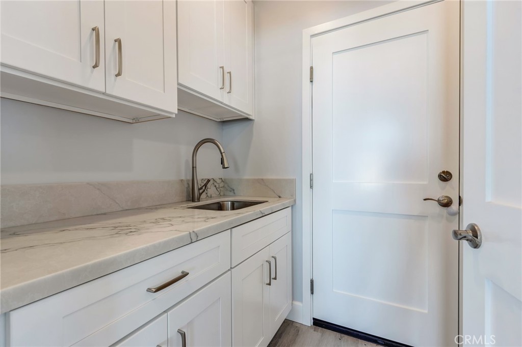 11128 Stamy Road Whittier, CA 90604 - Photo 38 of 40 a kitchen with a sink and cabinets