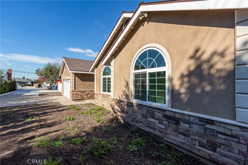11128 Stamy Road Whittier, CA 90604 - Photo 4 of 40 a front view of a house with a yard