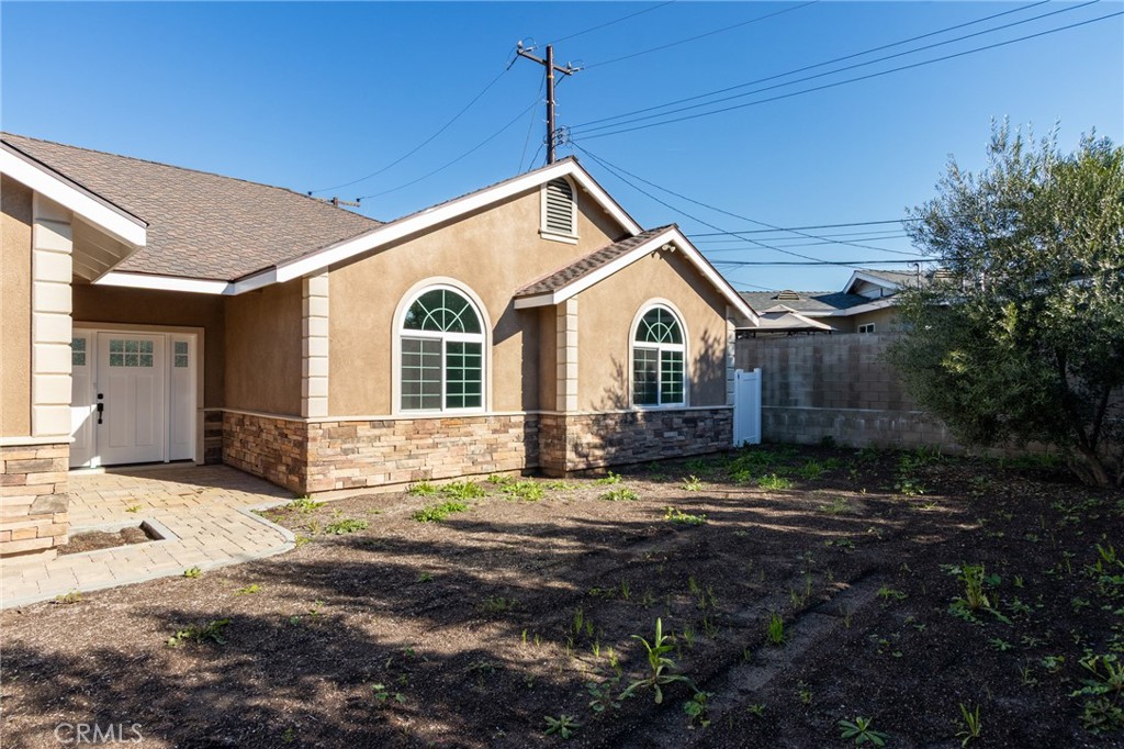 11128 Stamy Road Whittier, CA 90604 - Photo 6 of 40 a view of a house with a yard