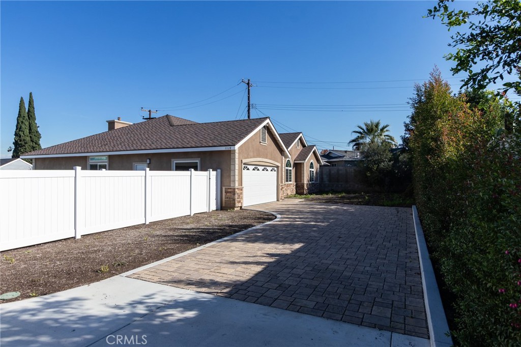 11128 Stamy Road Whittier, CA 90604 - Photo 8 of 40 a front view of a house with a yard and garage