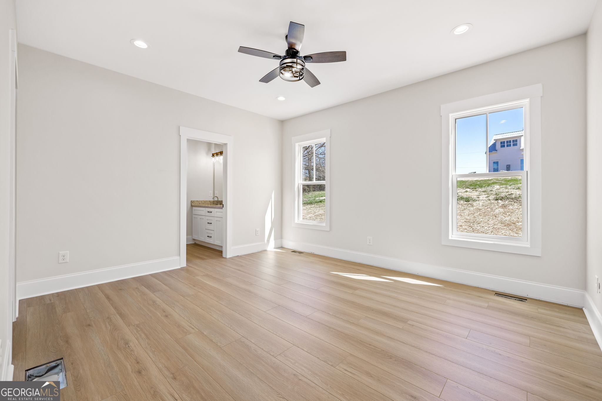 409 Roper Drive Clarkesville, GA 30523 - Photo 13 of 32 wooden floor in an empty room with a window