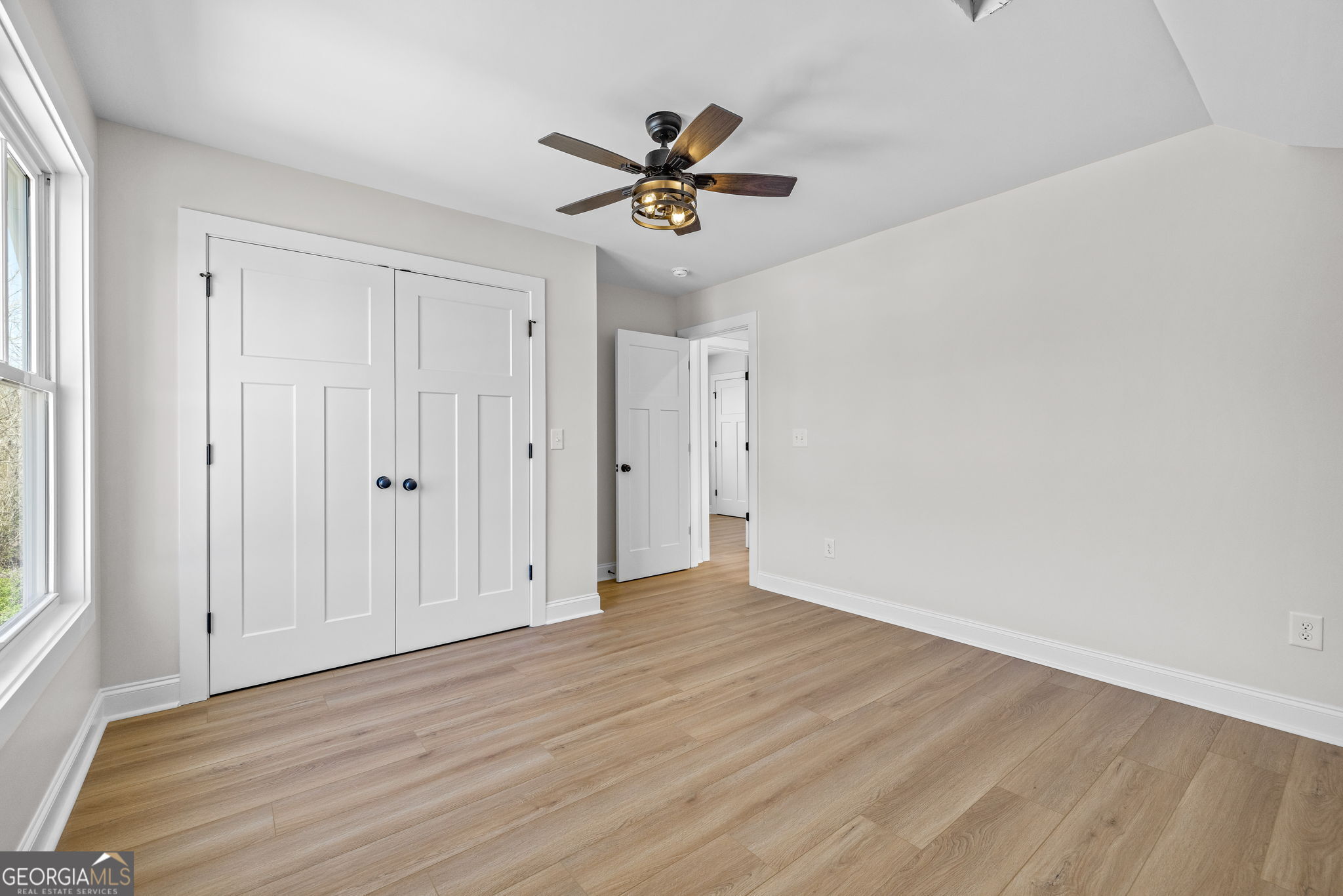 409 Roper Drive Clarkesville, GA 30523 - Photo 20 of 32 a view of a livingroom with a ceiling fan and window