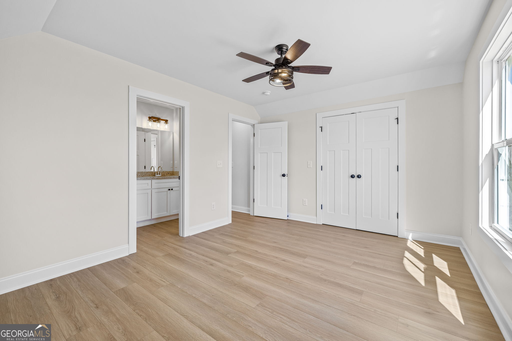 409 Roper Drive Clarkesville, GA 30523 - Photo 23 of 32 a view of empty room with wooden floor and window