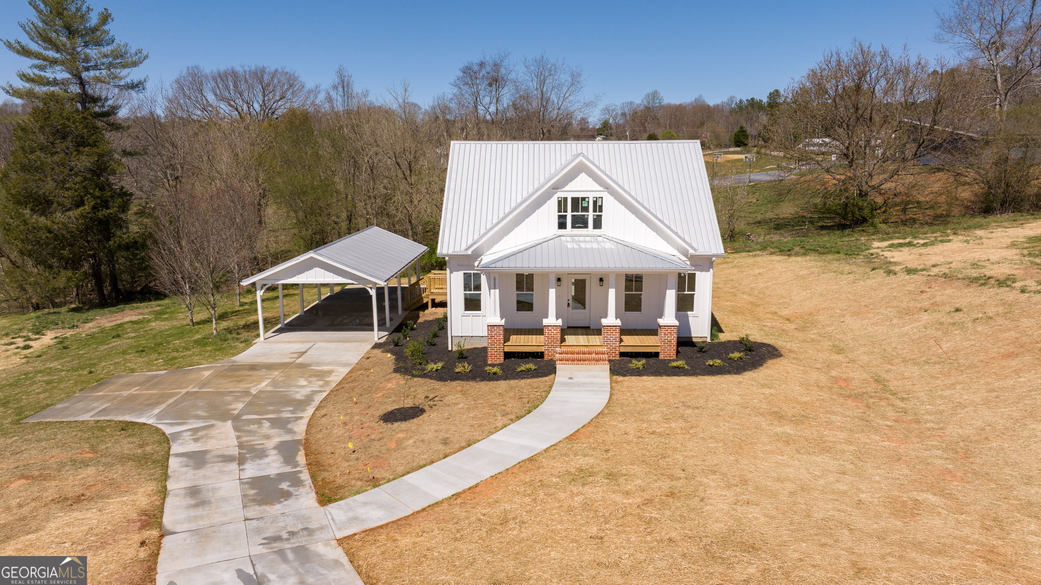 409 Roper Drive Clarkesville, GA 30523 - Photo 27 of 32 an aerial view of a house with swimming pool and sitting area