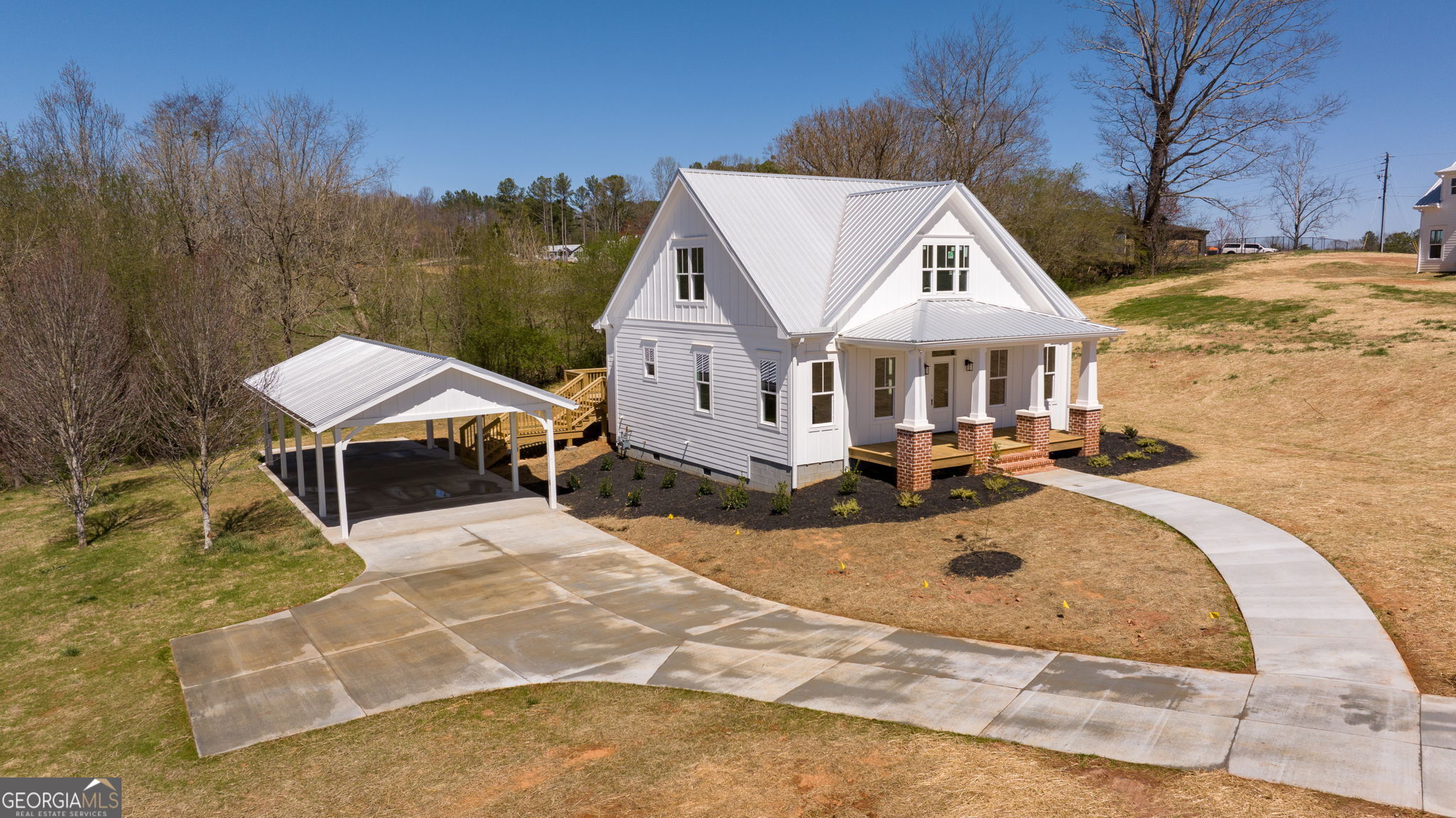 409 Roper Drive Clarkesville, GA 30523 - Photo 28 of 32 a view of a house with swimming pool and sitting area