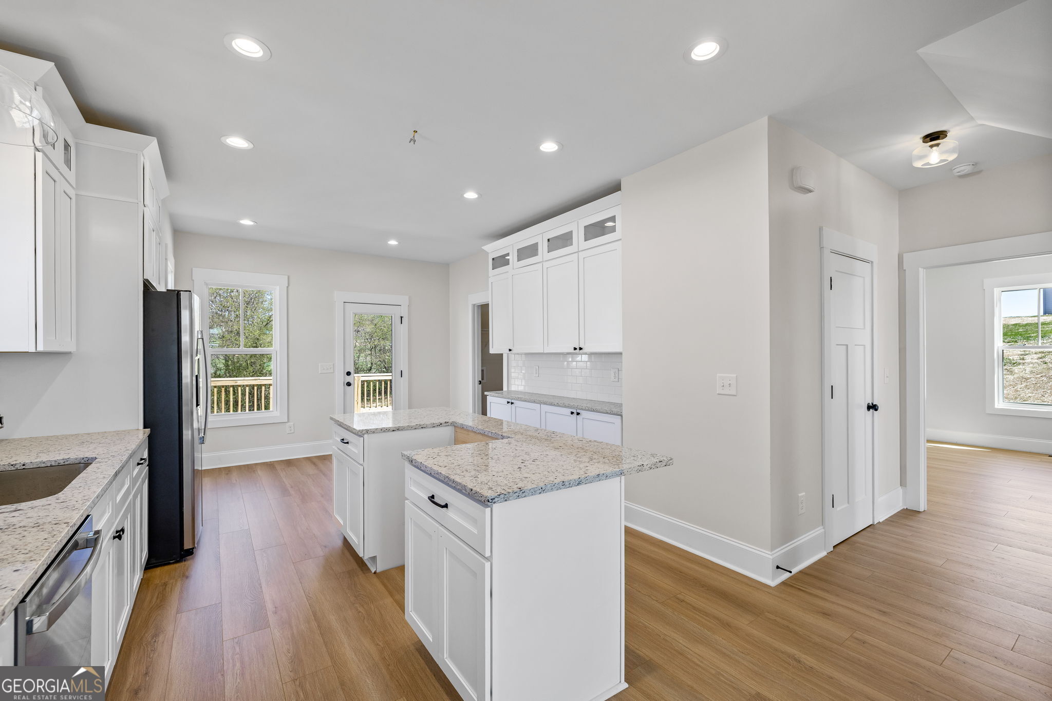 409 Roper Drive Clarkesville, GA 30523 - Photo 9 of 32 a kitchen with a sink stove and refrigerator