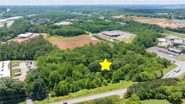 an aerial view of a house with a swimming pool yard and mountain view in back