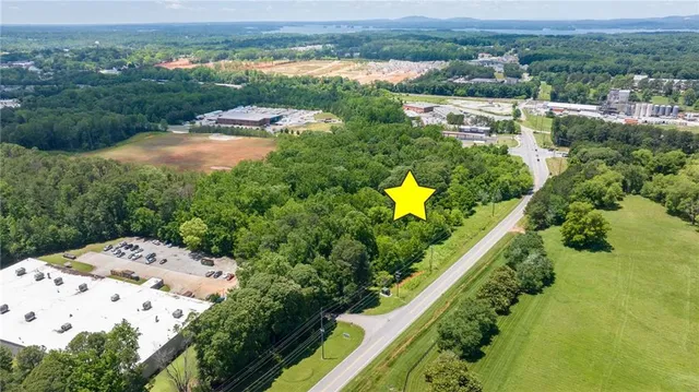 an aerial view of lake residential houses with outdoor space and swimming pool
