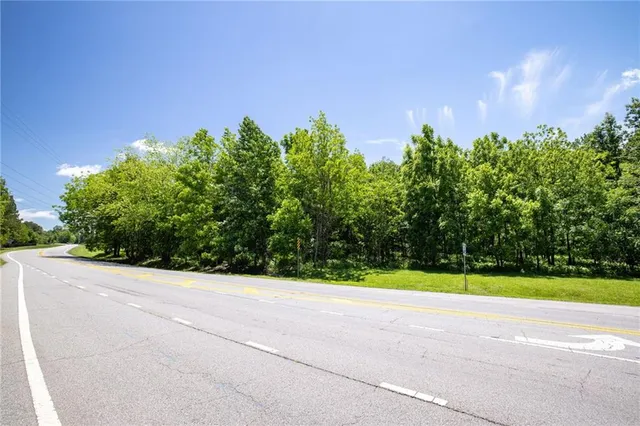 a view of a yard and a house in the background