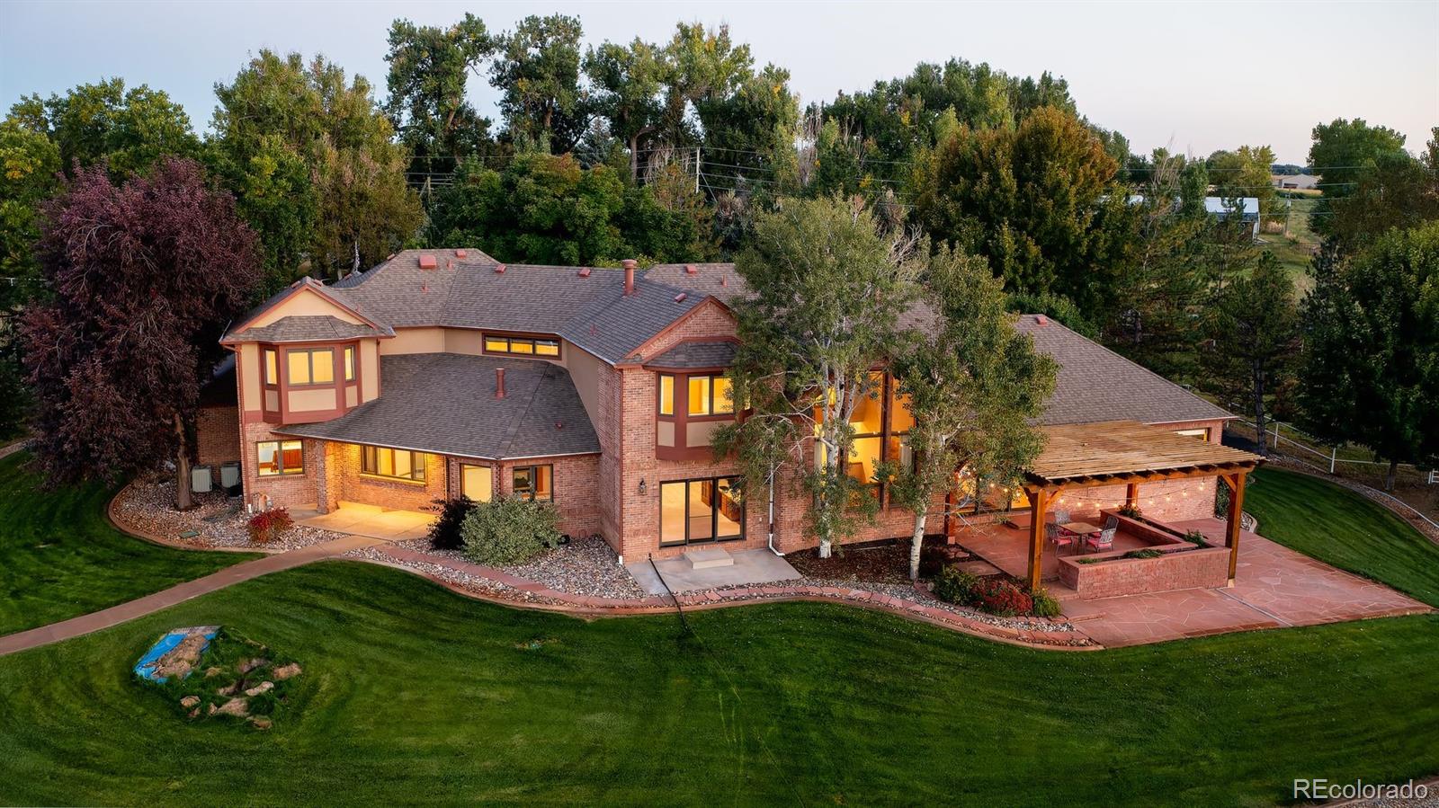 9741 Isabelle Road Lafayette, CO 80026 - Photo 1 of 39 a aerial view of a house with swimming pool and garden