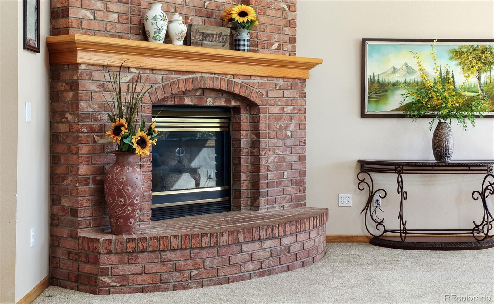 9741 Isabelle Road Lafayette, CO 80026 - Photo 15 of 39 a living room with a fireplace