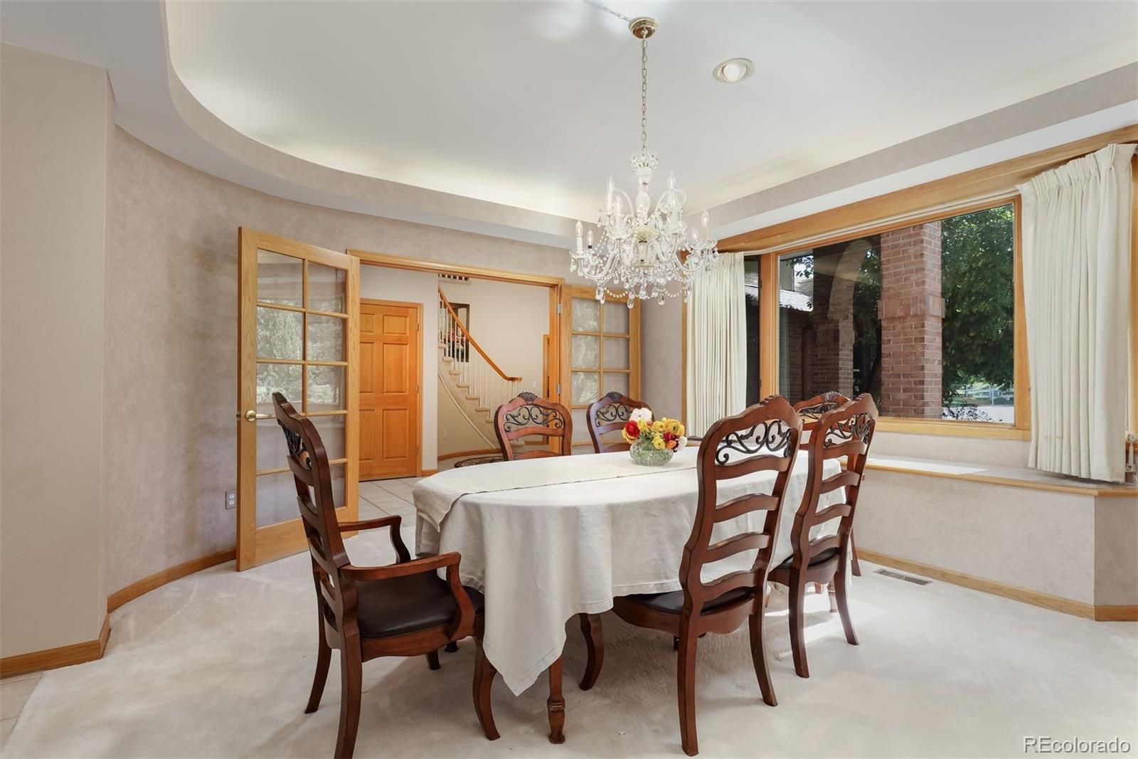 9741 Isabelle Road Lafayette, CO 80026 - Photo 17 of 39 a view of a dining room with furniture window and outside view