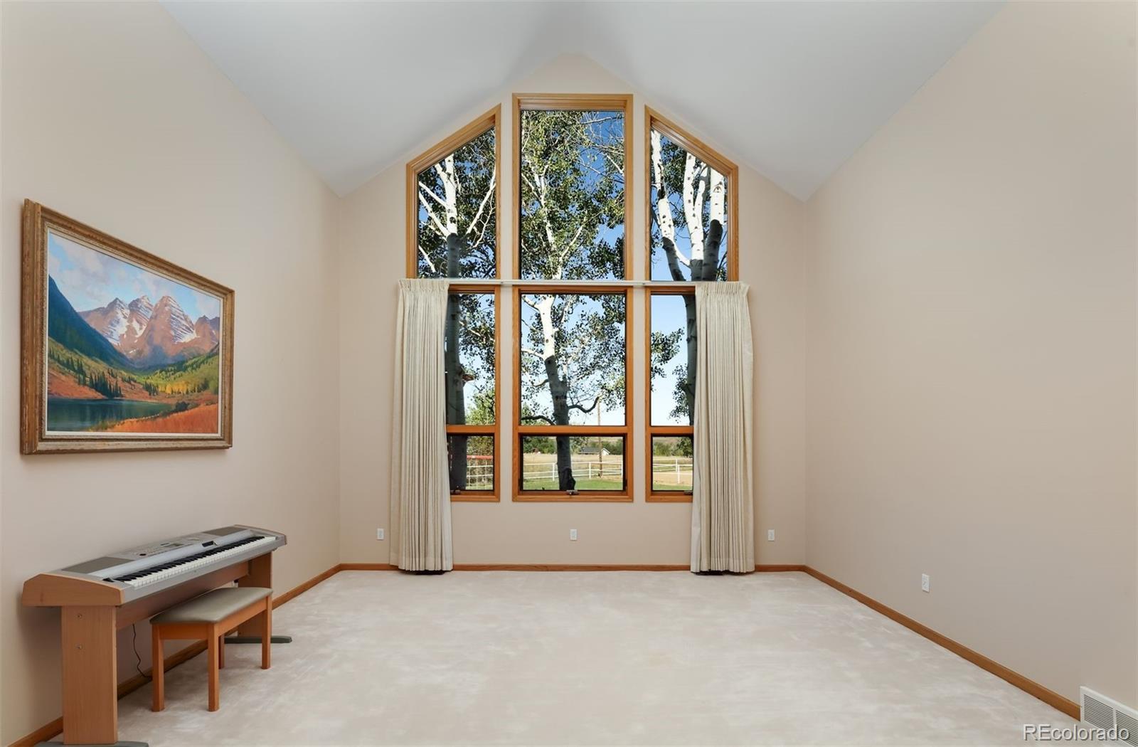 9741 Isabelle Road Lafayette, CO 80026 - Photo 19 of 39 an empty room with windows
