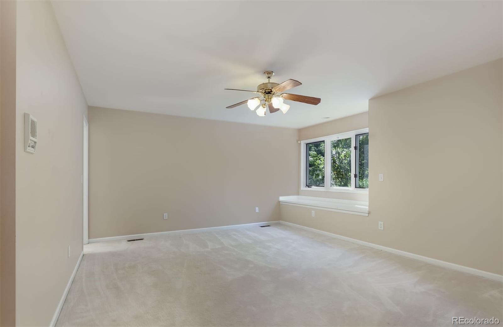 9741 Isabelle Road Lafayette, CO 80026 - Photo 29 of 39 a view of an empty room with a window