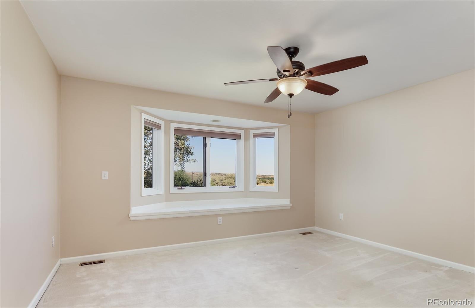 9741 Isabelle Road Lafayette, CO 80026 - Photo 32 of 39 a view of an empty room with a window